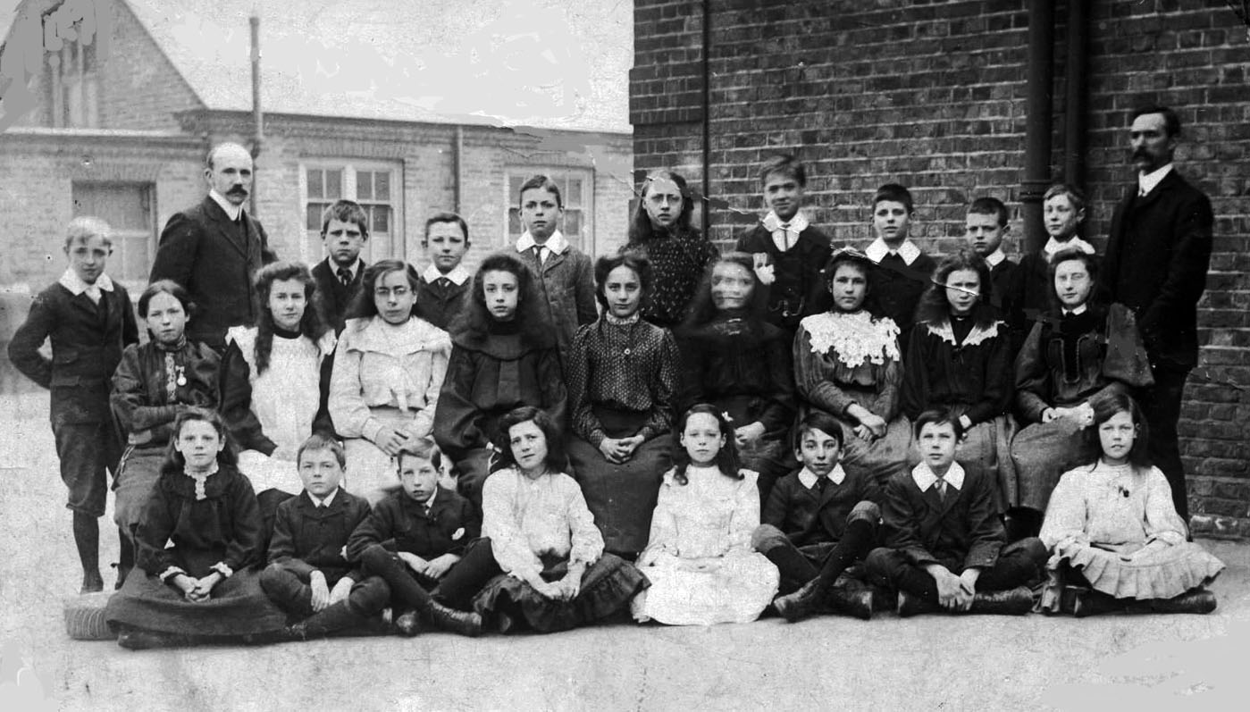 Mr. Price on the right with a mixed class around 1905